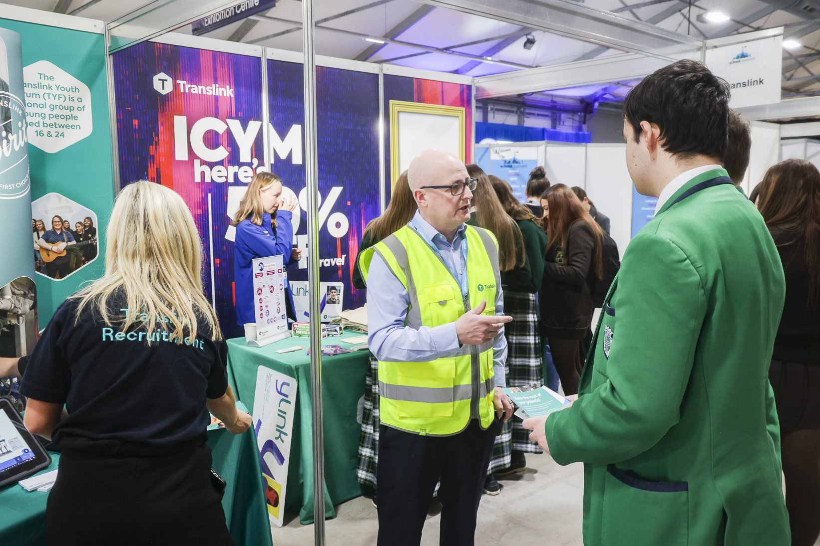 Pupils gathered at the Into Film branded exhibitor stand at School Summit Northern Ireland, 2024.