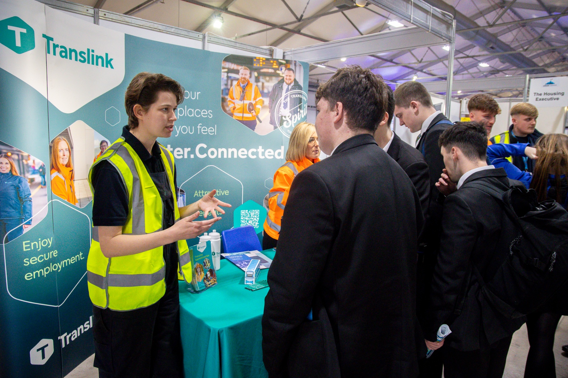 Pupils engaging with the Translink and Northern Ireland Fire & Rescue Service exhibitor row at School Summit Northern Ireland.